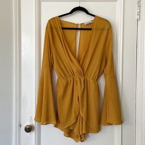 Sexy and chic mustard gauze romper by Lioness.